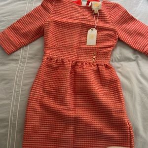 Emily McCarthy orange and pink striped dress with gold accents